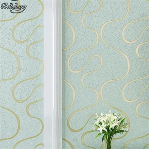 Beibehang Yellow green red modern simple non-woven wallpaper warm bedroom 3D stereo stripes living room TV background wallpaper