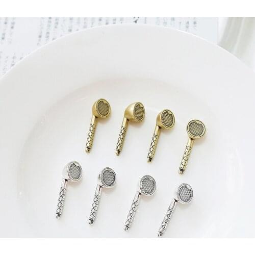 Interesting simulation wireless headset K gold and white K belt hanging diy handmade ear accessories material bag pendant