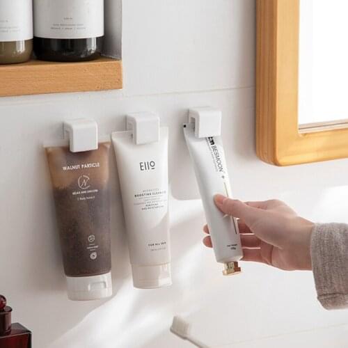 Wall-mounted Toothpaste Storage Clip Rack Free Punching Cleanser Skin Care Products Bathroom Wall Storage Clip Toiletry Supplies