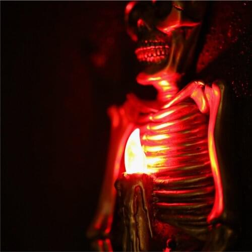 The new wall-mounted skeleton statue Flame lamp European style resin sculpture Creative Horror Home Bar Craft Statue Red light