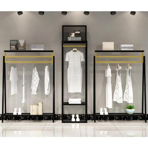 Clothing store display shelf floor type shelf mens and womens clothing store display shelf black and gold combination clothes