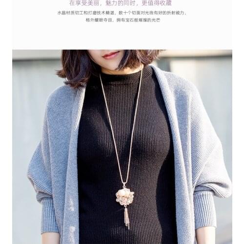 Faux Pearl sweater with a long chain that goes with everything
