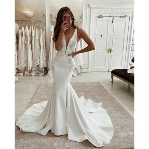2020 Charming Deep V Neck Mermaid Wedding Dresses Arabic Backless Appliqued Lace Bridal Gowns Satin Sweep Train Wedding Dress