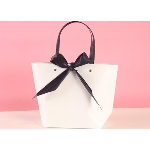 100 pieces/lot quality bowknot cosmetic gift bags paper with handles