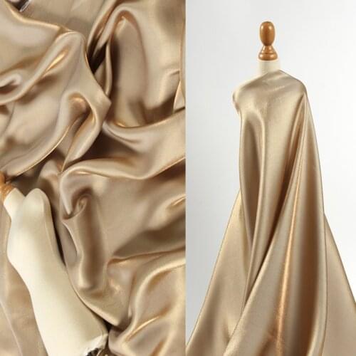 Gradient Gold Silk Super Soft High Drape Glittering Satin Silk Fabric Silky Wedding Dress Shiny Designer Fabric Wholesale cotton