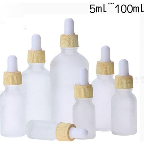 50pcs clear frosted glass essential oil bottle plastic with wood grain cover dropper bottle cosmetic packaging container