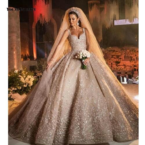 Luxury Ball Gown Wedding Dresses 2021 Sleeveless Bridal Gown Backless Sweetheart Royal Train Beaded Chamourous Plus Size Bride
