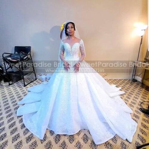 Luxury Pearls Beads Wedding Dress With Long Sleeves Arabic Dubai Women Puffy A Line Sheer Neck Chapel Train Bridal Dresses