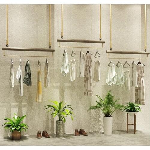 Simple retro clothing store display rack clothing rings ceiling clothes rack high and low womens clothing store shelves