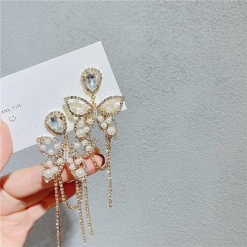 Korea New Pearl Water Drop Butterfly Earrings Fashion Temperament Tassel Long Hollow Pendant Earrings Womens Jewelry