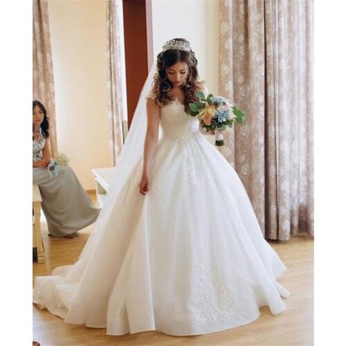 Gorgeous Princess Wedding Dresses O-neck Appliqued Puffy Ball Gown Sleeveless Bridal Dresses White Ivory Wedding Gowns 2020