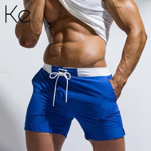 KE Lace-up mens casual sports solid color shorts beach pants youth large size quick-drying five-point mens swimsuit
