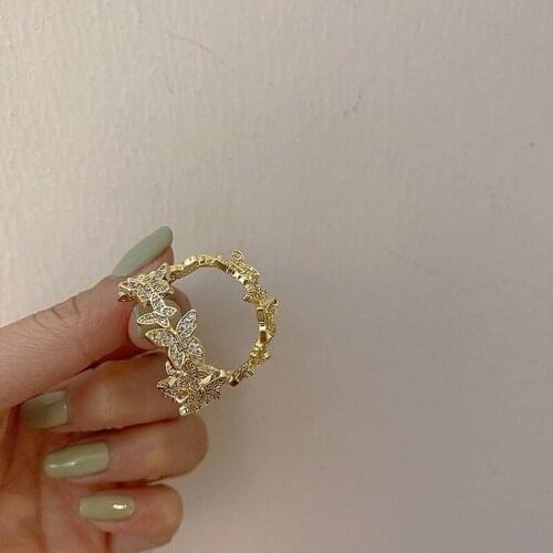 U-Magical Exaggerated C Shape CZ Zirconia Bow-knot Hoop Earring for Women Textured Gold Metal Earring Jewelry Chic Accessories