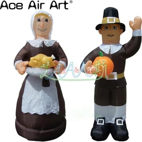 Inflatable combination of woman carrying turkey and man holding pumpkin for thanksgiving