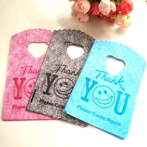 Hot Sale New Style Wholesale 50pcs/lot 9*15cm 3 colors Thank You Mini Plastic Gift Bags Jewelry Packaging With Smile Face