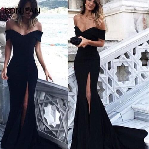 Glamorous Form Fitting Satin Mermaid Dress Featuring a off-the-shoulder Neckline and Leg slit Perfect For Prom Evening Formal