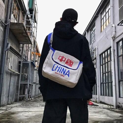 Fashion male shoulder bag Chinese character style couple Wear resistant Super fire portable Messenger bag female canvas big bag