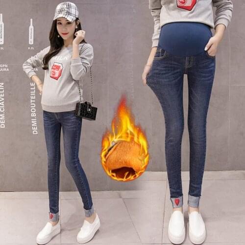 Pregnant women plus velvet thick jeans autumn and winter pregnant women belly lift pants were thin and warm feet pants