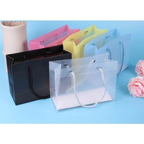 Customized logo / trademark / brand spot PP plastic transparent handbag PVC packaging bag cosmetic handbag PVC frosted transluce