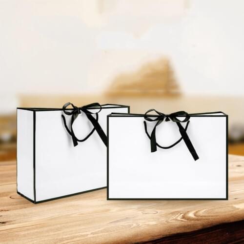 2019 New Kraft Paper Bags Elegant Child Party Birthday Food Paper Kraft Gift Handbags Packaging Gift Bags For Pajamas Clothes