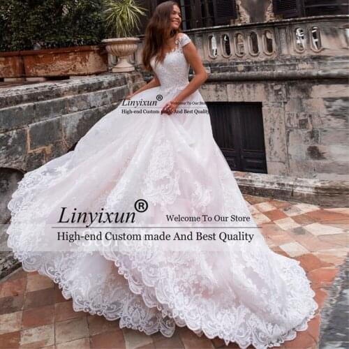 Gorgeous Appliques Cap Sleeve A-Line Wedding Dress 2021 Elegant Scoop Neck Button Court Train Tulle Vintage Wedding Gown