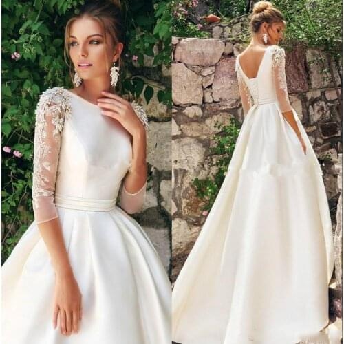 New Backless Wedding Dress Crew Neck Satin Applique Pearls A line Sweep pull Wedding Dress Roben De Maria
