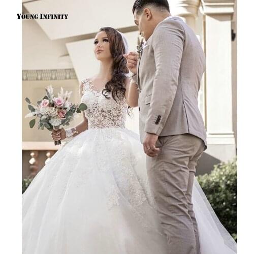 Elegant Ball Gown Wedding Dresses 2021 Long Sleeves Bridal Gown Illusion Back Scoop Chapel Train Beaded White Plus Size Bride