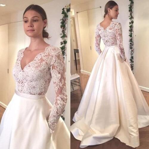 2020 New Appliqued Lace Wedding Dresses Sexy Deep V-neck Illusion Long Sleeves A-line Wedding Gowns Bridal Dress