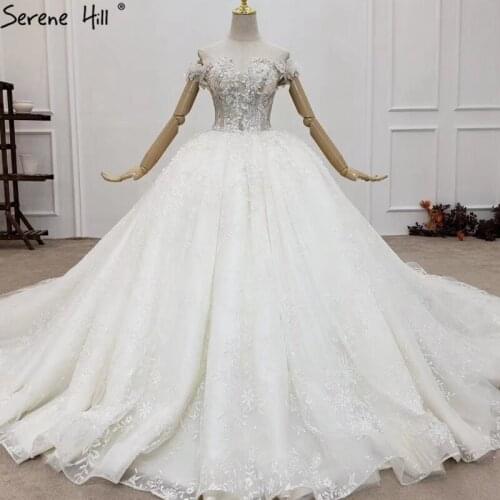 Ivory Handmade Flowers Sequins Sexy Wedding Dresses 2021 Dubai Sparkle Off Shoulder Bridal Gowns HX0152 Custom Made