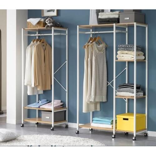 Wardrobe rack. Floor-to-ceiling, minimalist clothes rack. A steel frame closet