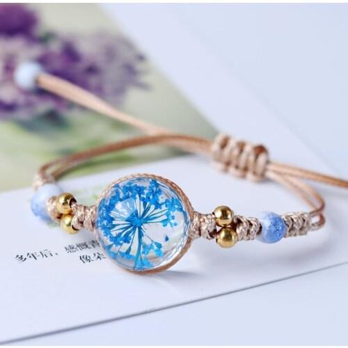 Japanese and Korean romantic dried flower transparent crystal ceramic nylon rope knotted ladies bracelet, symbol of happiness