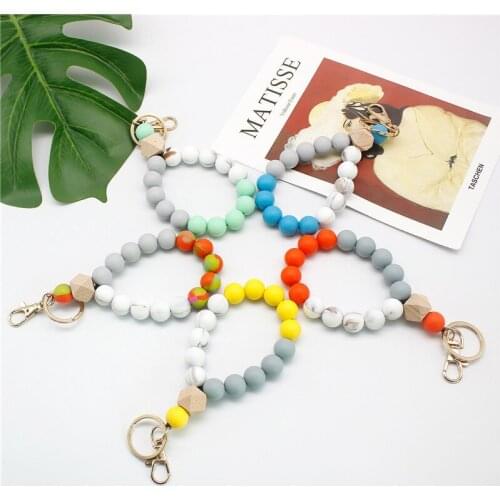 Julie Wang 1PCS Silicone Keychain Silicone Wood Beads Bracelet Key Chain Keyring For Men Women Anime Car Bag Accessory Decor