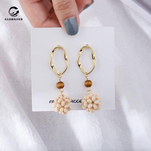 Tibetan Silver needle Korean temperament simple metal material geometry long wooden beads hand-knit ball earrings 156