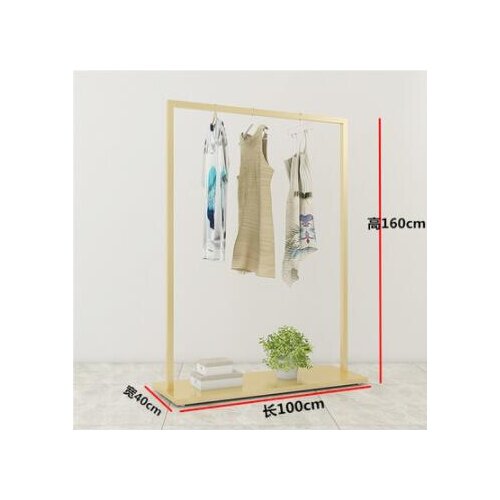 Gold clothing store display rack floor-to-ceiling window clothing rack