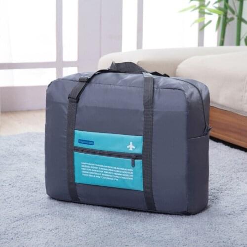 Korean version of Oxford cloth receives quilt bags luggage bags waterproof nylon folding storage bags large capacity clothing ba
