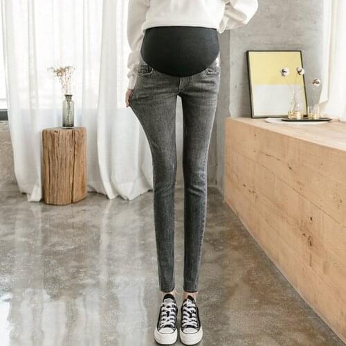 Maternity denim trousers spring and autumn thick maternity stomach lift pants feet pants chrysanthemum embroidery leggings