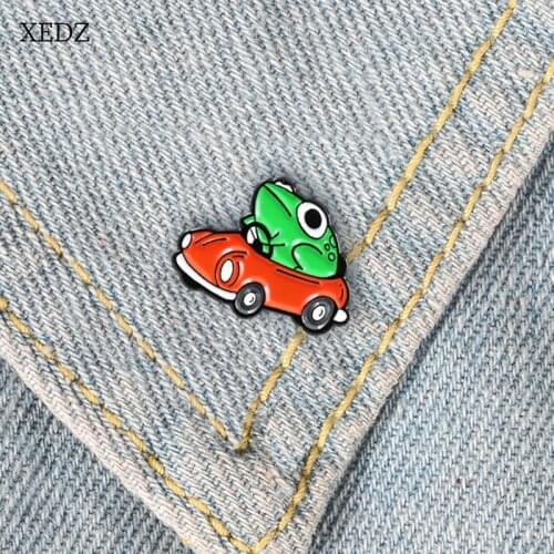XEDZ New creative fun green frog driving brooch frog prince driving red car brooch cartoon children backpack animal frog glazed