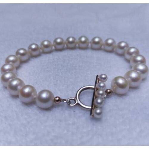 Stunning near round white fresh water pearl bracelet circel clasp