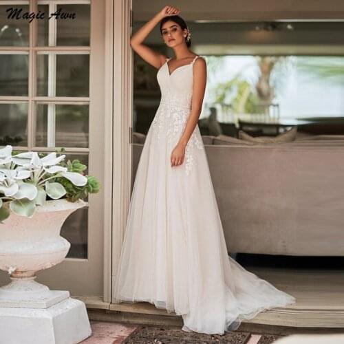 Magic Awn Elegant 2021 Wedding Dresses Lace Appliques Spaghetti Straps Boho Bridal Gowns With Pockets A-Line Beach Robe Mariage