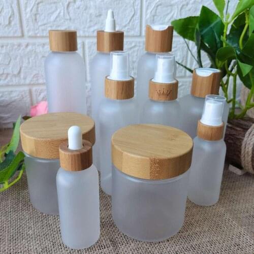 Cosmetic Bottle Cream Jar With Bamboo Wood Lid Frosted Clear Plastic Container Skin Care Packaging Bottle Custom Logo Bottles