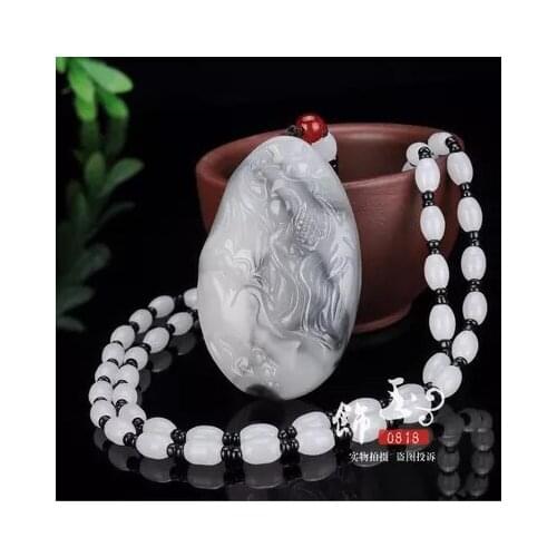 Xinjiang Hetian blue and white jade hanging over the year