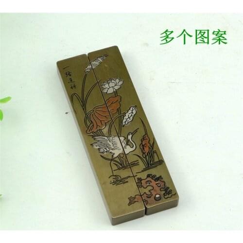 A pair of copper paperweights