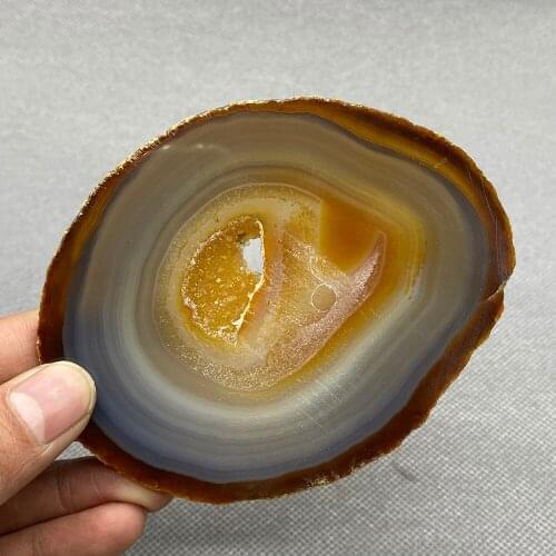 Natural agate slice polished ore specimen with crystal hole