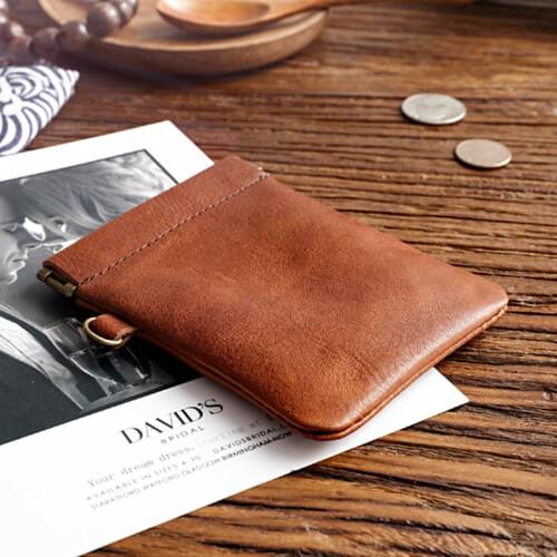 ERAL Travelers Cowhide stationery storage bag. Automatic spring clamp, Genuine cowhide, Pocket change coin bag