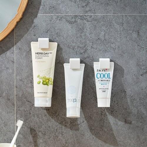 Toothpaste Rack Self-adhesive Hanging Holder Stand Wall Hook Facial Cleanser Clip Home Storage Organizer bathroom accessories