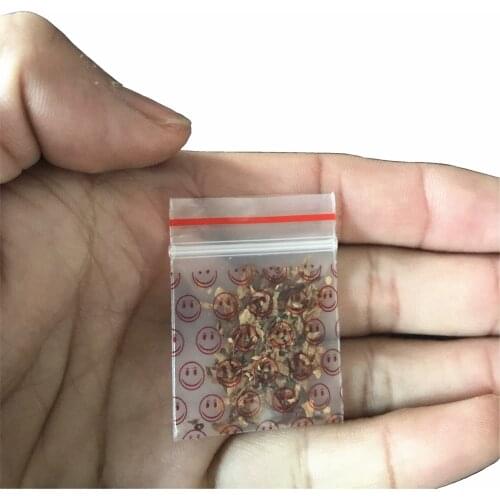 1 pack (100pcs)cartoon tobacco bag sealed bag storage bag Transparent Red smile pattern with holder tobacco bag pipe