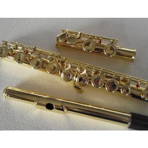 Brand new Gold plated 16 key closed hole flute C tune +E key
