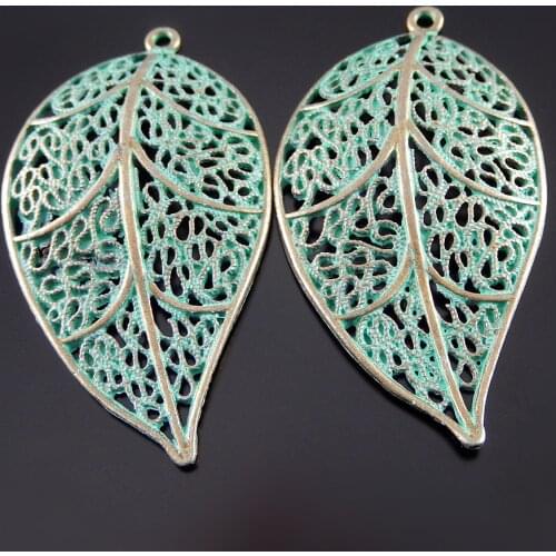 Julie Wang 10pcs Antique Bronze Charms Simulated Retro Green Hollow Leaves Pendants Hanging Jewelry Crafts Necklace Accessory
