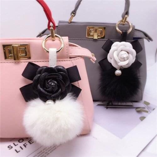 2021 New Creative Camellia bow keychain ladies fox fur ball key ring fashion ornaments bag pendant