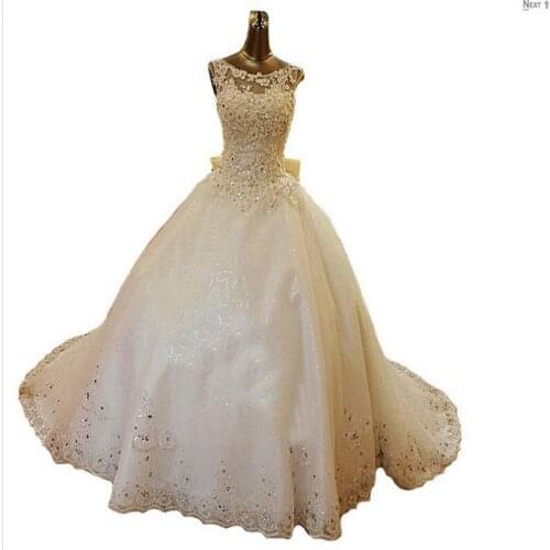 2019 New Bling Crystal Wedding Dresses Scoop Appliques Beads Backless Pearl Bows Ball Gown Court Train Lace Tulle Luxury Custom